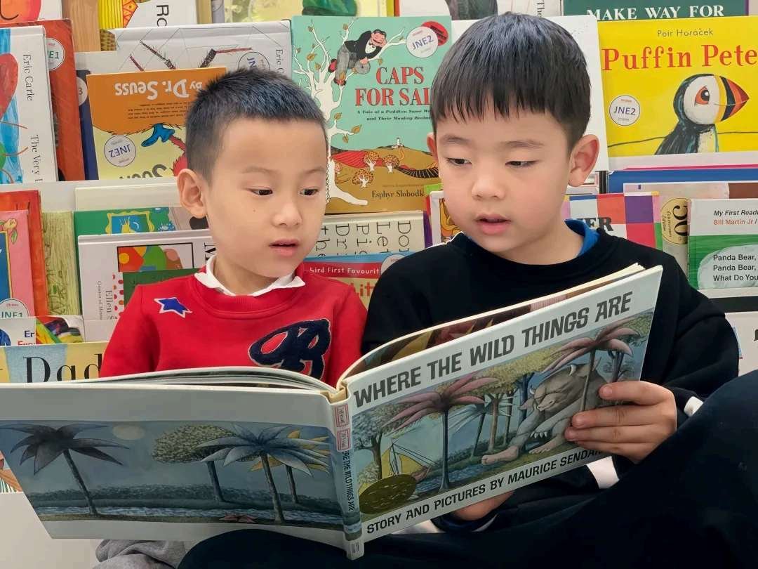 Students reading Where the Wild Things Are