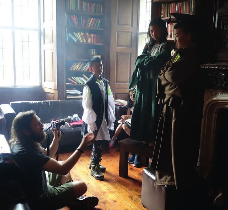 Students rehearsing a scene in costume